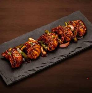 Chi. Wok Tossed Momos in Spicy Chilly Sauce