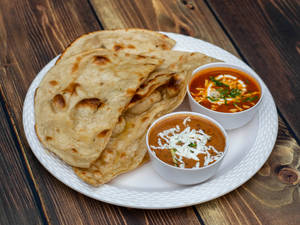 Paneer Butter Masala and Dal Makhni With Choice of Breads