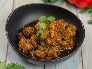 Vegetable Dumplings In Manchurian Sauce