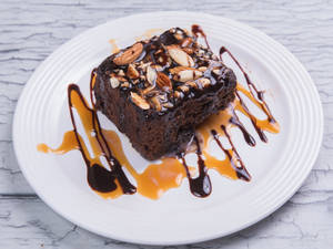 Dark Chocolate Walnut Brownie With Chocolate Sauce