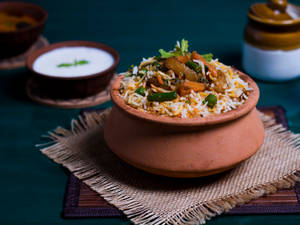 The Urban Pind Spl. Paneer Mushroom Veg Biryani Served With Gravy +  (rasbhari Jamun Rasgulla Box)