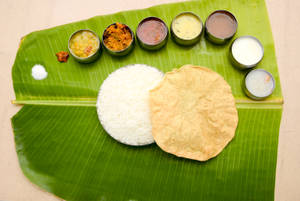 Meals (Rice + Sambar + Puli Kolambu + Rasam + Poriyal + Kottu + Appalam + Payasam + Curd) - 550gm