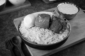 Mutton Biryani With Egg And Raita