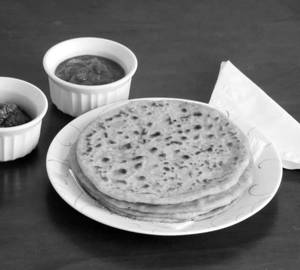 Sattu  Paratha Served With Curd + Hari Chutney 