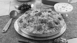 Mutton Seekh Kebab Biryani(boneless)(served With Raita And Gravy)