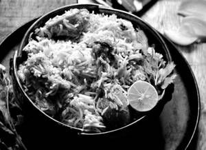 Chicken Dum Lucknowi Biryani With Free Cold Drink & Raita