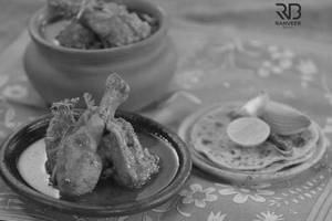 Chicken 2 big pcs with gravy and 4 roti