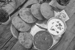 Bedmi Poori (4 Pcs) + Aloo Kachori(2 Pcs) With Aloo Curry And Plain Raita                           