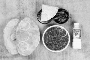 Chole [250ML] + 2 Bhature + Pickle + Salad + Chass + Roasted Papad
