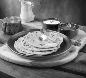 Paneer Paratha Served With Curd & Pickle