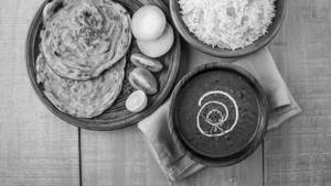1 Aloo Paratha + Dal Makhani + Jeera Rice + Curd + Soft Drink