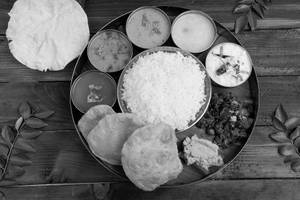 Poori, Sambar, Rasam, Palya, Rice, Sabzi, Papad, Sweet & Papad