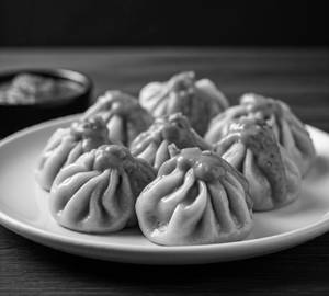 Chicken Schezwan Sauce Momos