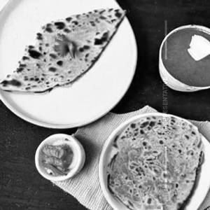 Lachha paratha with chicken kosha + water