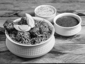 Hyderabadi Chicken Dum Biryani [3 Pcs] Served With Egg, Raita And Gravy