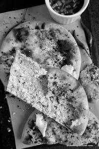 Paneer Kulcha served with white butter and desi achar