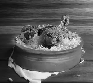 Chicken Dum  Biryani (Serves 2)  3 pieces  + 1 Water Bottle 500 Ml + 1 Paper Plate.