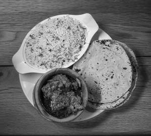 Mutton handi [150 grams, 3 pieces] with biryani rice and 4 roti
