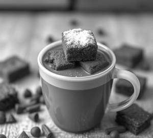 Brownie Dunked In Hot Chocolate