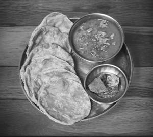 Dal Fry With 6 Poori And Pickle+Salad