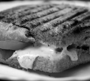 1 Nos. Veg Cheese Grilled Sandwich with Mint Chutney / Ketchup.