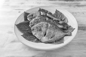 Braised whole pomfret