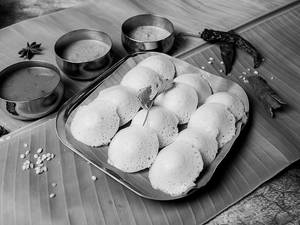 Button Idli Dipped In Sambar With Ghee