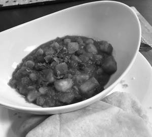 Aloo Chana Masala Ki Sabji With 2 Nos. Soft Butter Tawa Roti& Refreshing Butter Milk.