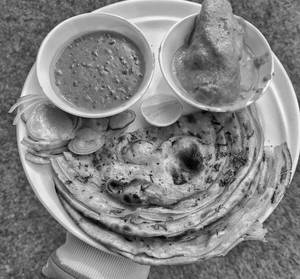 2Pc Paratha + Special Chicken Curry + Dal Makhani + Aachar + Onion 
