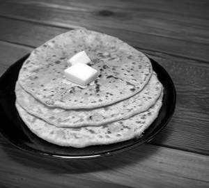 1 Aloo Paratha served with curd and pickle 