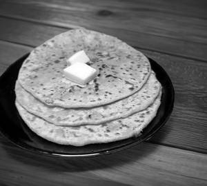 2 Aloo Pyaaj Paratha Served With Curd And Pickle