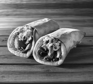 2 Kuboos Roll Shawarma & 2 Classic Lime (300ml)