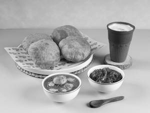 Aloo Poori + Choice Of Lassi