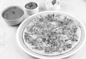 Tomato Uttapam (Served with Cocunut Chutney, Red Chutney and sambar)