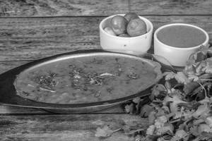Dal Fry Combo(Half Dal Fry + 4 Tawa Roti Butter + Raita + Salad)