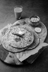 Paneer Paratha 1piece (with Dahi)