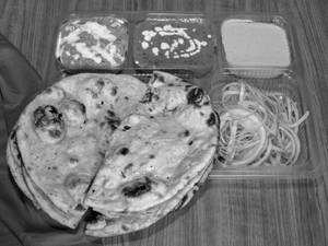 Thali (Dal Makhni +Shahi Paneer+Rice+2 Roti+Salad)