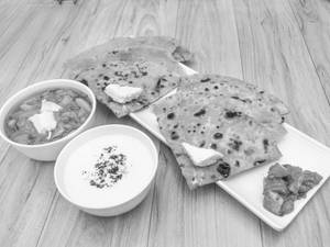 Aloo paratha [1] with dahi [1 bowl]