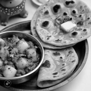 Aloo Zeera + 1 Missi Roti+ 2 Butter Roti