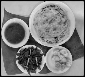 Kerala Parotta (2 Piece) With Buff Chilly