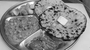 2 Amritsari Kulche With Black Dal Punjabi Tadka And Raita