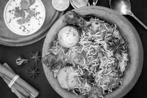 Chicken Tangdi Biryani With Egg
