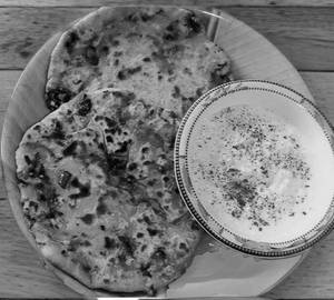 Mix paratha with creamy curd spicy green mirchi Achar