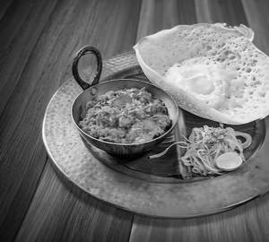 Sunny Side Up Appam With Chicken Sukha