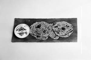 Pyaaz Paratha.   With raitia