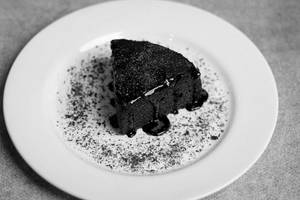 Death By Choco Cake Slice With Chocolate Sauce