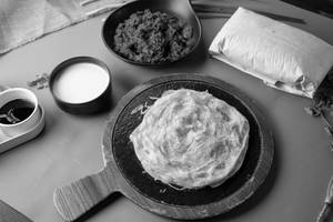 Thenga Paal Prawns Kizhi Parotta
