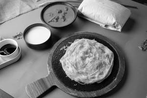 Thenga Paal Chicken Kizhi Parotta