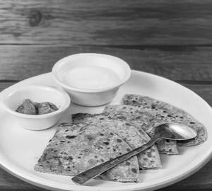 2 aloo pyaaz paratha with butter and pickle