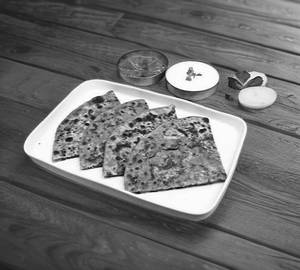 Paneer pyaaz paratha with curd and pickle